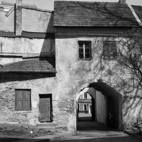 Image showcasing an aged building, exuding a vintage charm in black and white