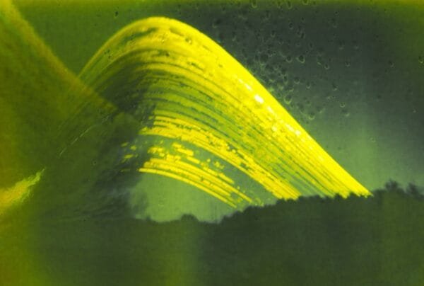 A captivating photo featuring a yellow wave, representing the sun's journey over a duration of six months